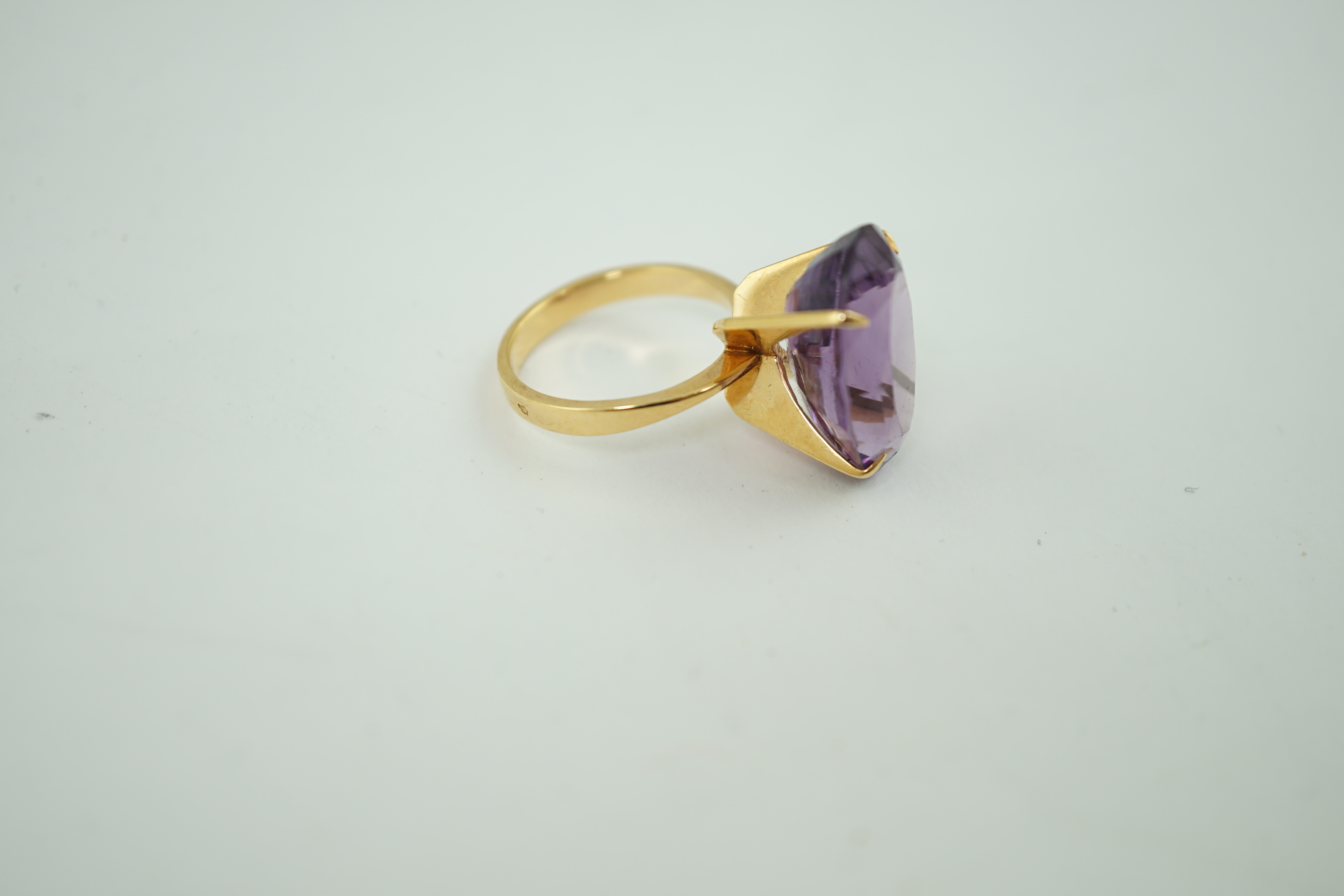 A mid 20th century French 18k gold and single stone oval cut amethyst set dress ring